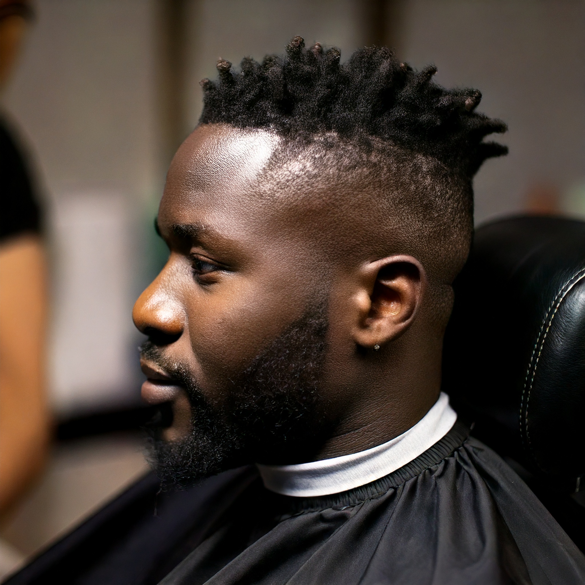 Firefly black man sitting in a barber chair, GQ style professional hairstyle, headshot 13698