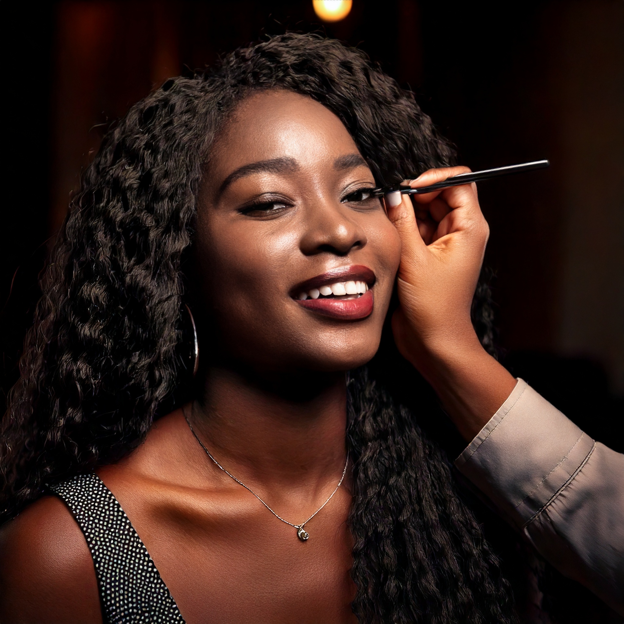 Firefly black woman getting makeup done at a salon smiling 1438
