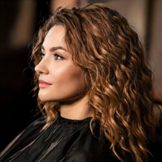 Firefly woman sitting in a barber chair getting hair done with beautiful curly hair, headshot. drama